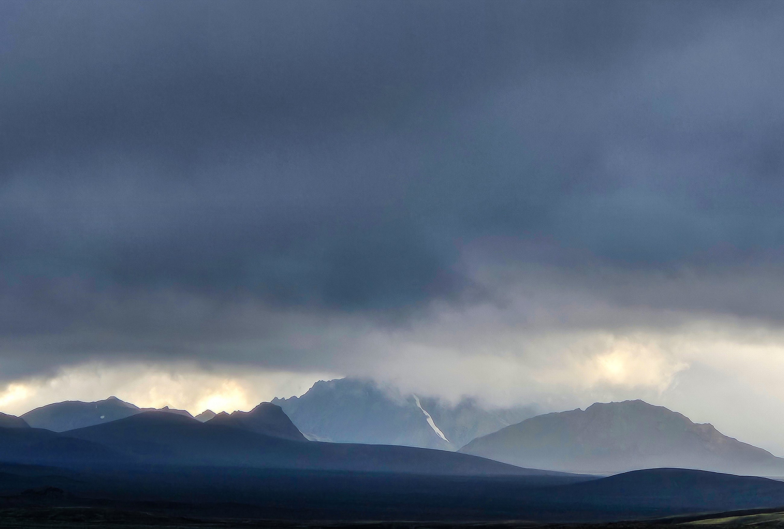 Icelandic mountain landscape with clouds and evening light
